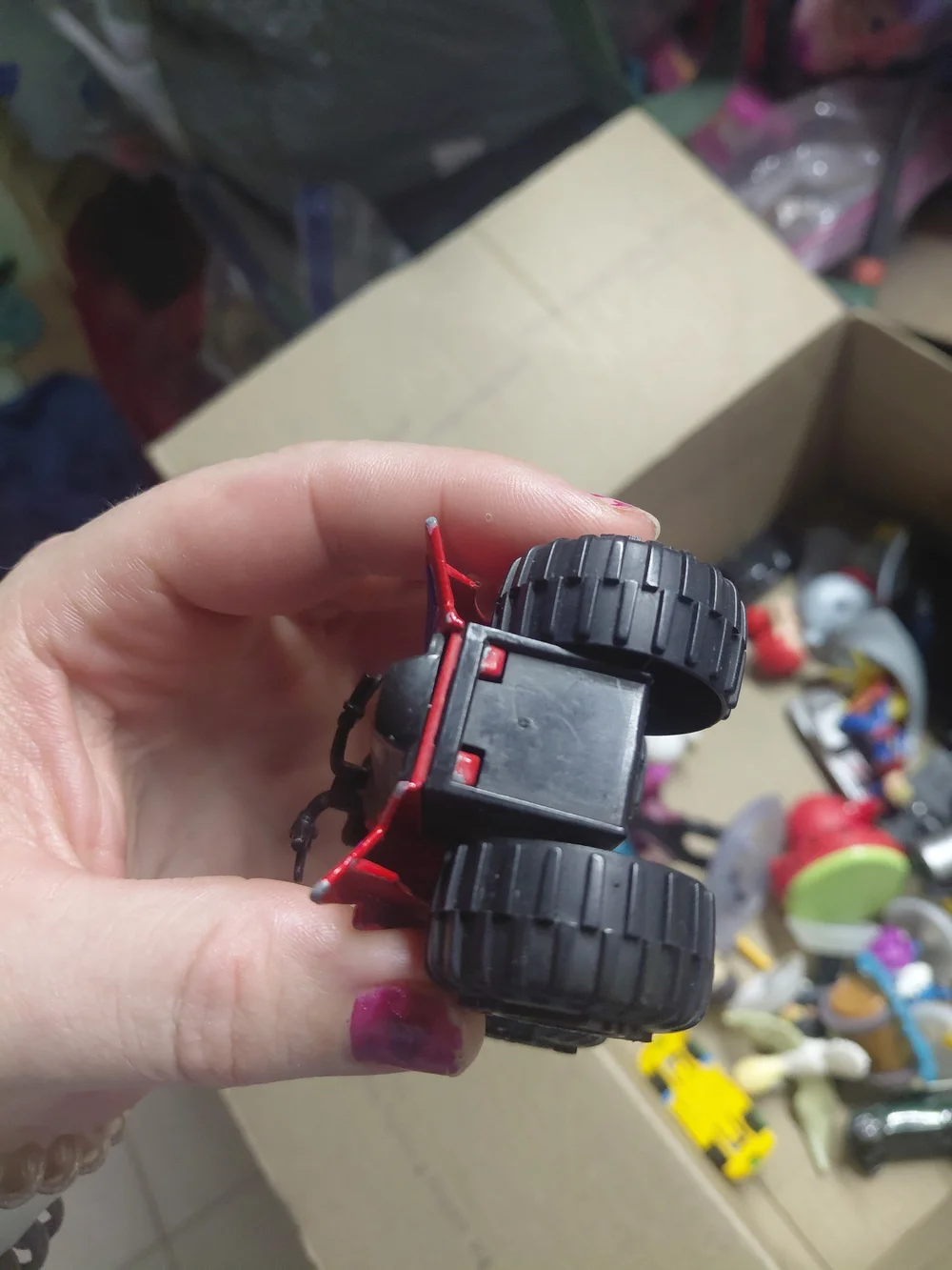 a Greenbrier International EX500 3-inch die-cast red quad ATV toy,